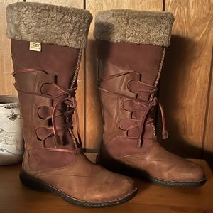 Like new UGG size 9 tall lace up leather boots.